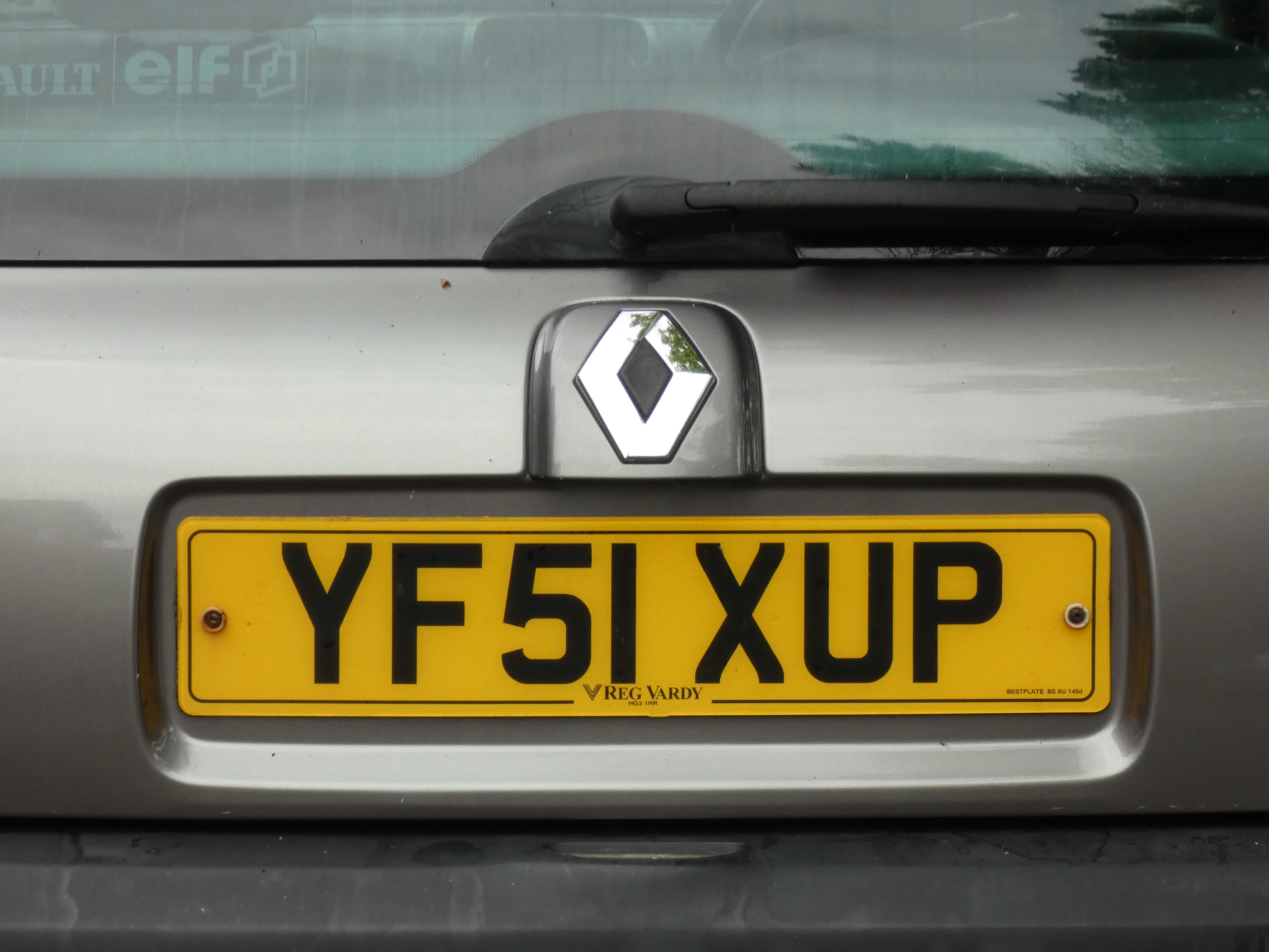 Close-up of a UK number plate on the rear of a car, showing crisp characters