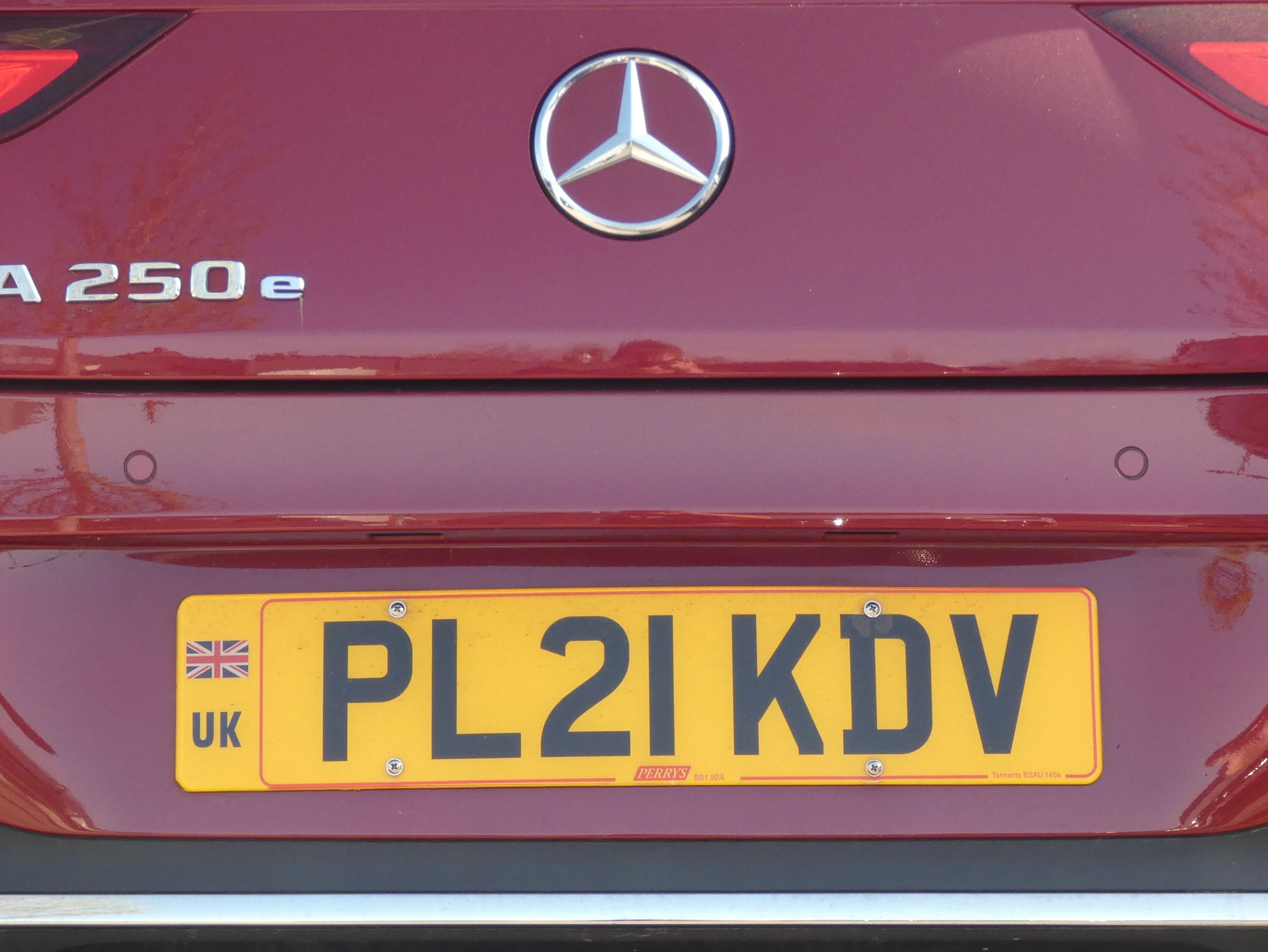 Standard UK yellow rear number plate on a car