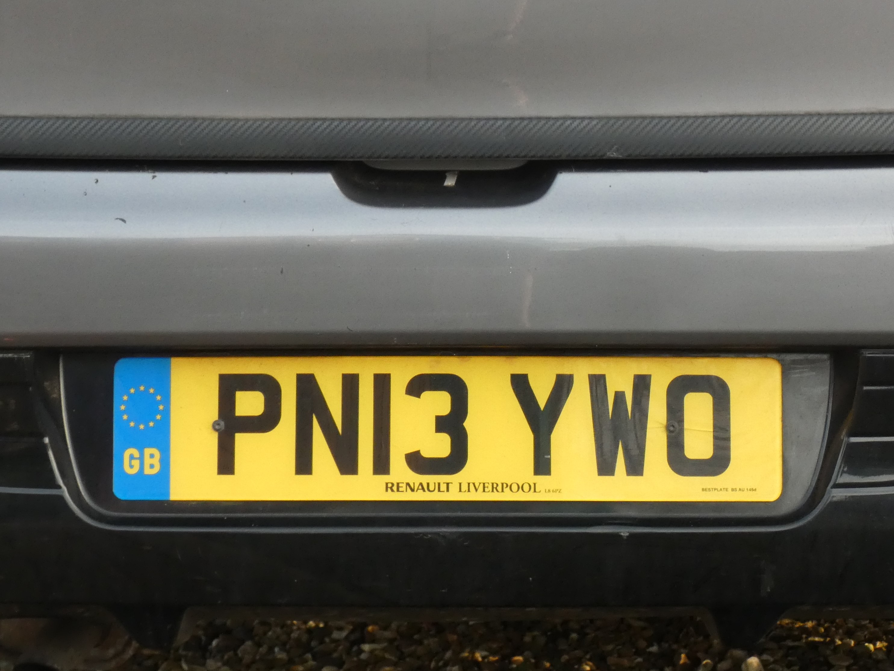 Close-up of a UK car number plate mounted on the rear of a car